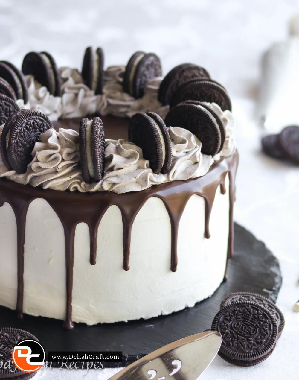 Delicious homemade Oreo Cake topped with cream and crushed Oreo cookies.