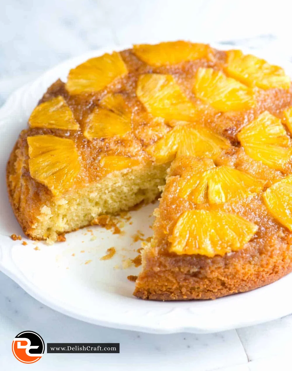 Delicious homemade pineapple cake with a slice ready to serve
