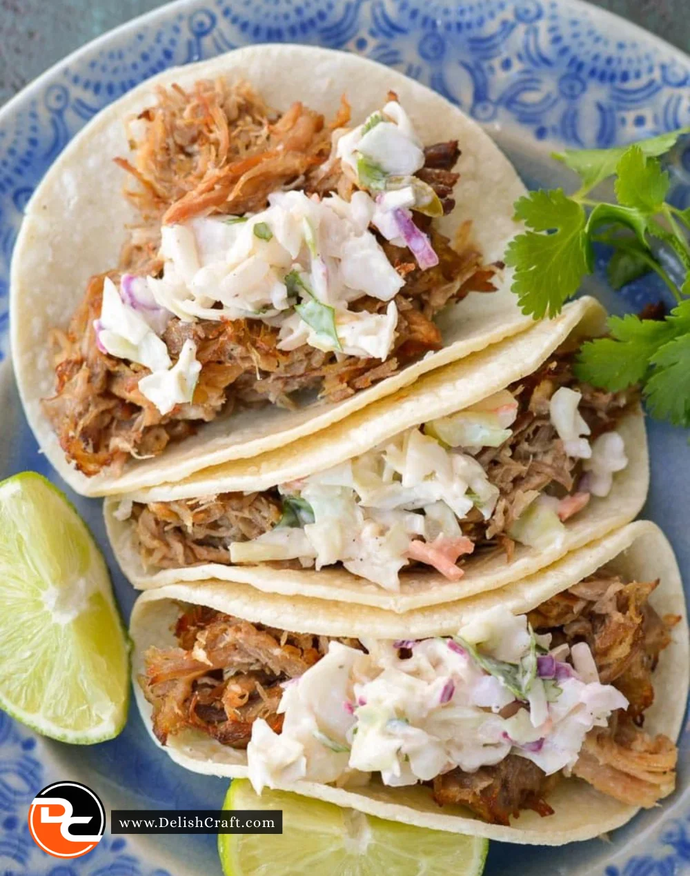 Slow cooker carnitas served with fresh jalapeño slaw on the side