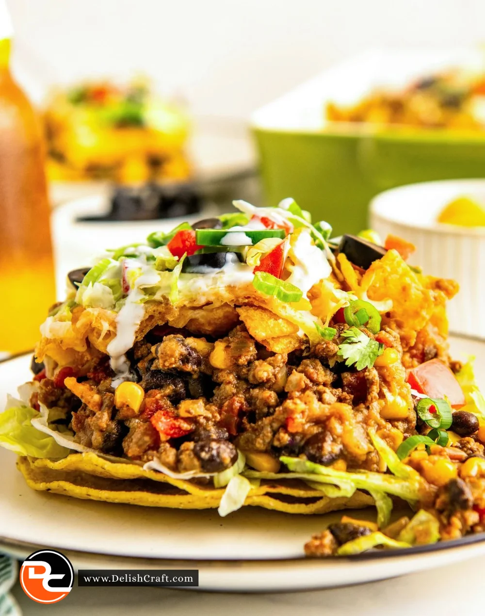 Taco Bake Casserole topped with cheese and fresh ingredients in a baking dish