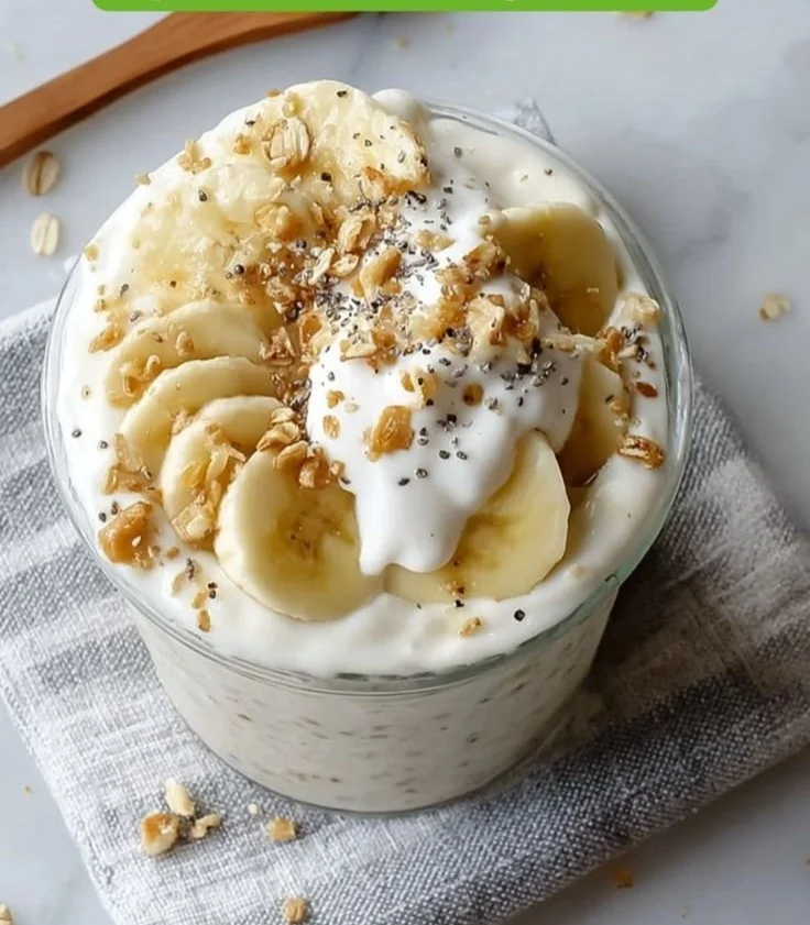 Delicious banana cream pie overnight oats topped with banana slices and whipped cream