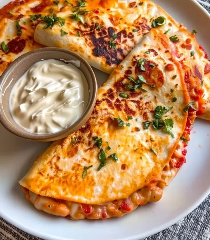 Plate of Buffalo White Bean Tacos garnished with fresh toppings