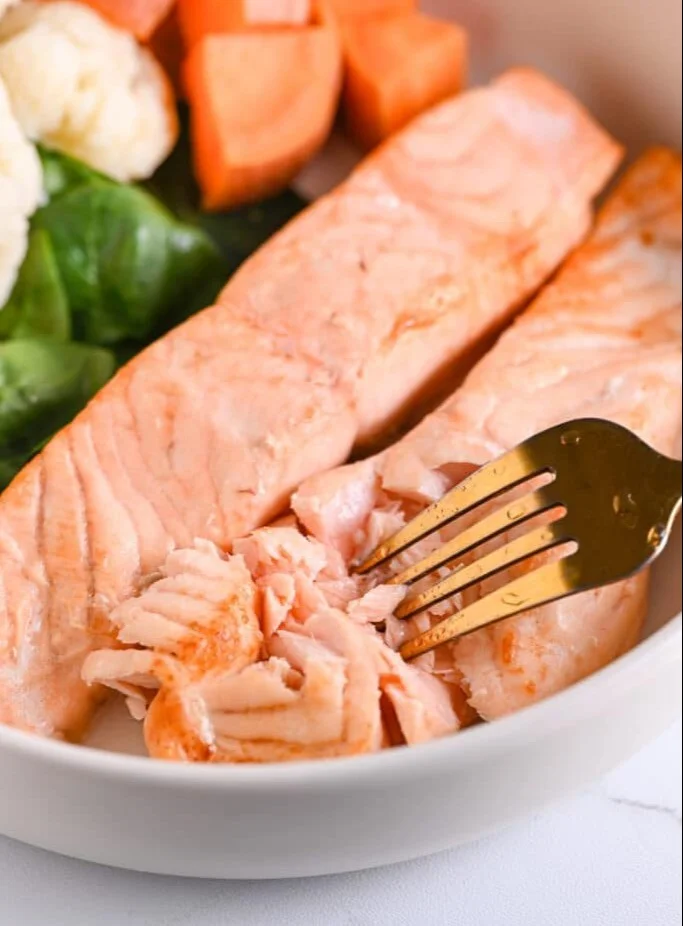 Delicious frozen salmon cooked in an air fryer for a quick meal.