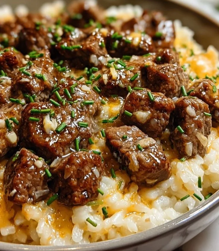 Delicious Garlic Butter Beef Rice topped with herbs and spices