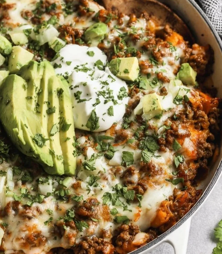 Ground Beef Enchilada Skillet served in a skillet with toppings
