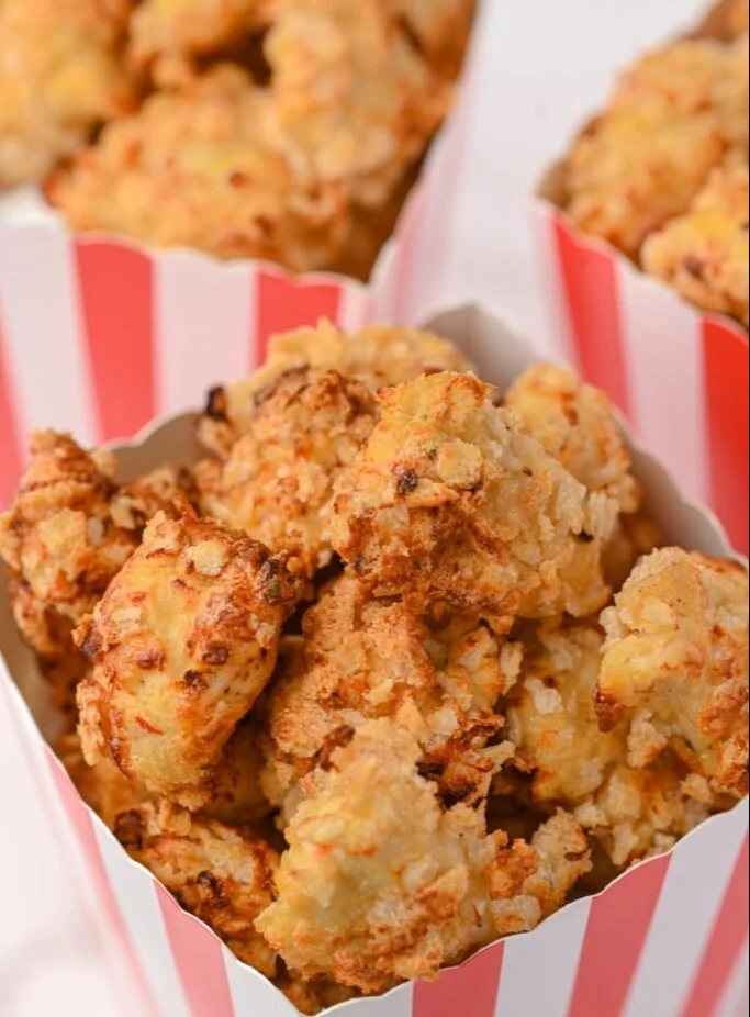 A serving of healthy KFC Popcorn Chicken with a fresh salad on the side.