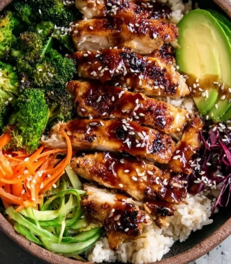 Healthy sticky chicken bowls with vibrant vegetables and tasty sauce