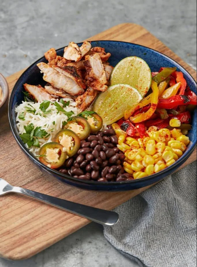 High Protein Burrito Bowl with grilled chicken, beans, and fresh veggies