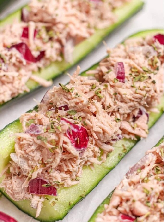 High-protein tuna cucumber boats garnished with fresh herbs