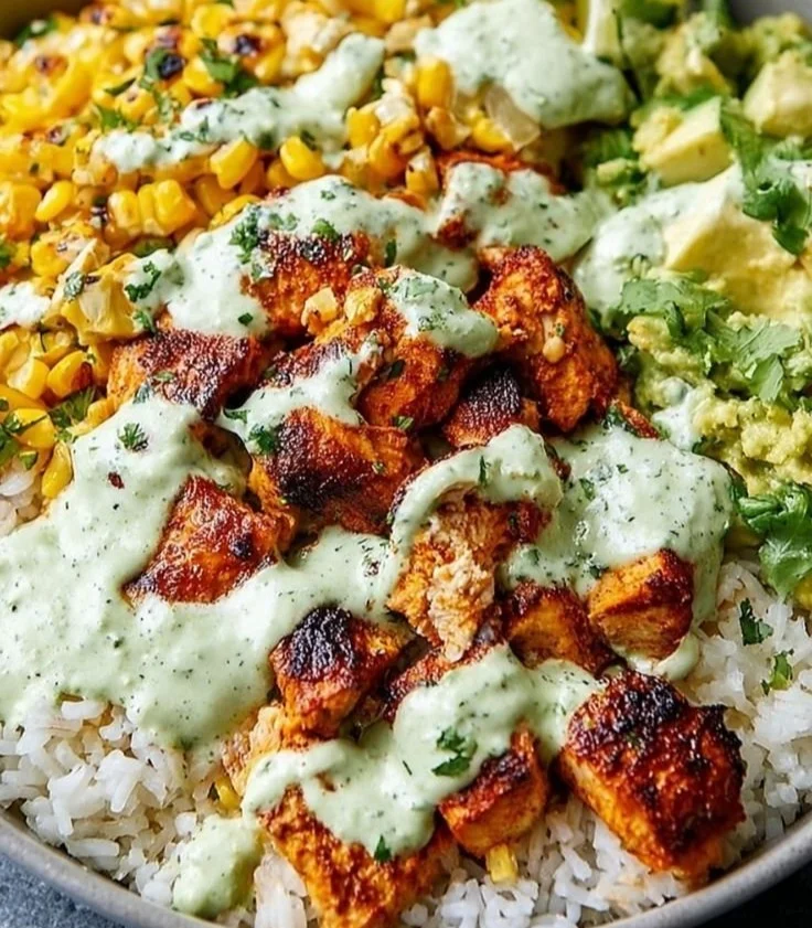 Delicious Street Corn Chicken Rice Bowl topped with grilled chicken and fresh corn