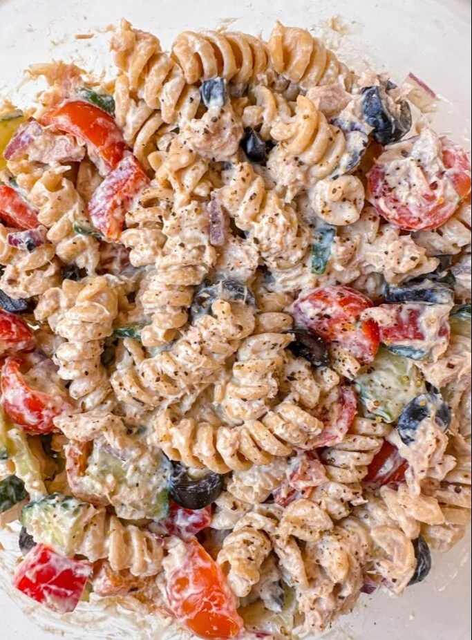 Delicious Tuna Pasta Salad with vegetables and dressing served in a bowl.