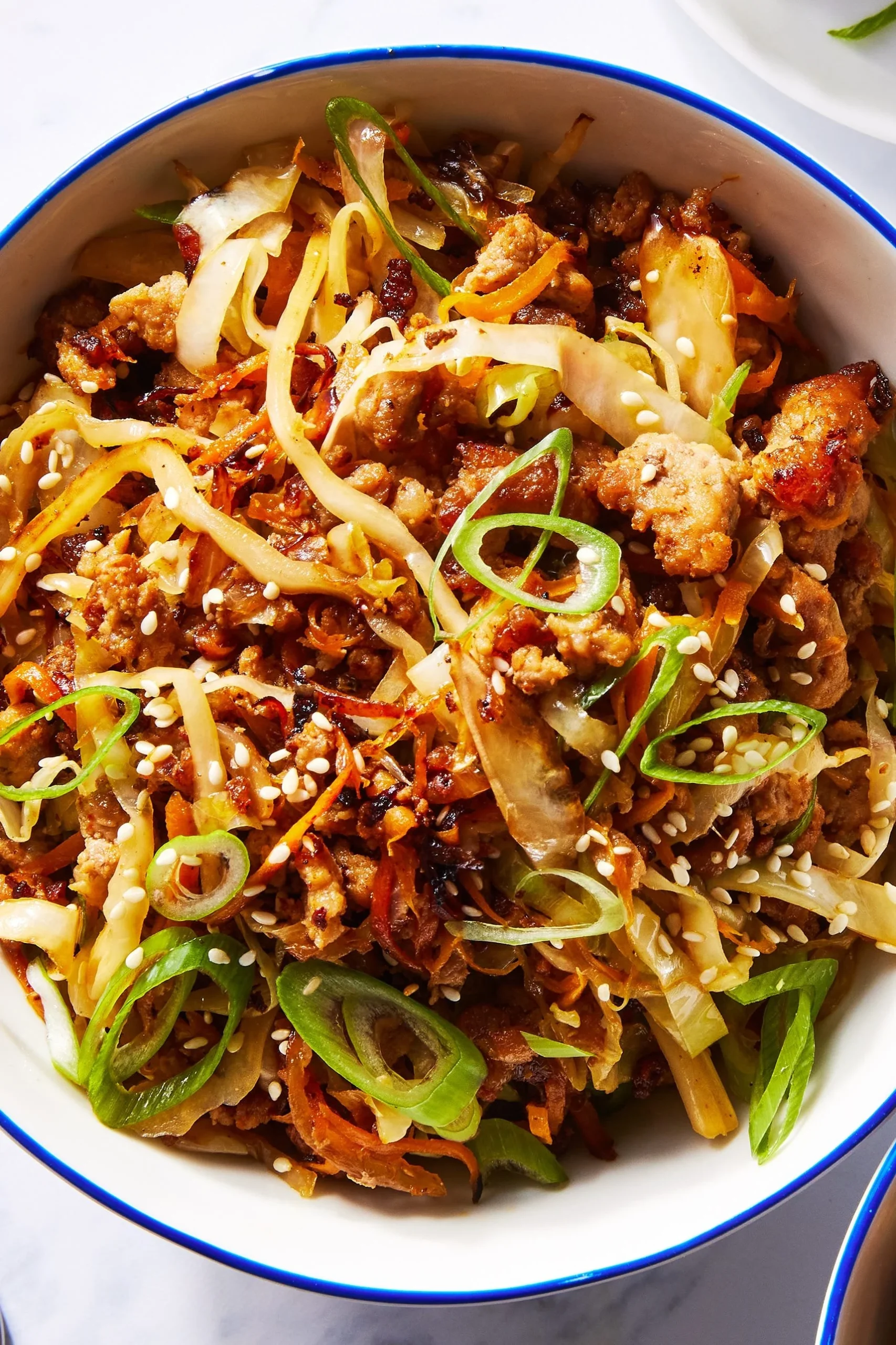 Colorful egg roll bowls filled with fresh vegetables and protein