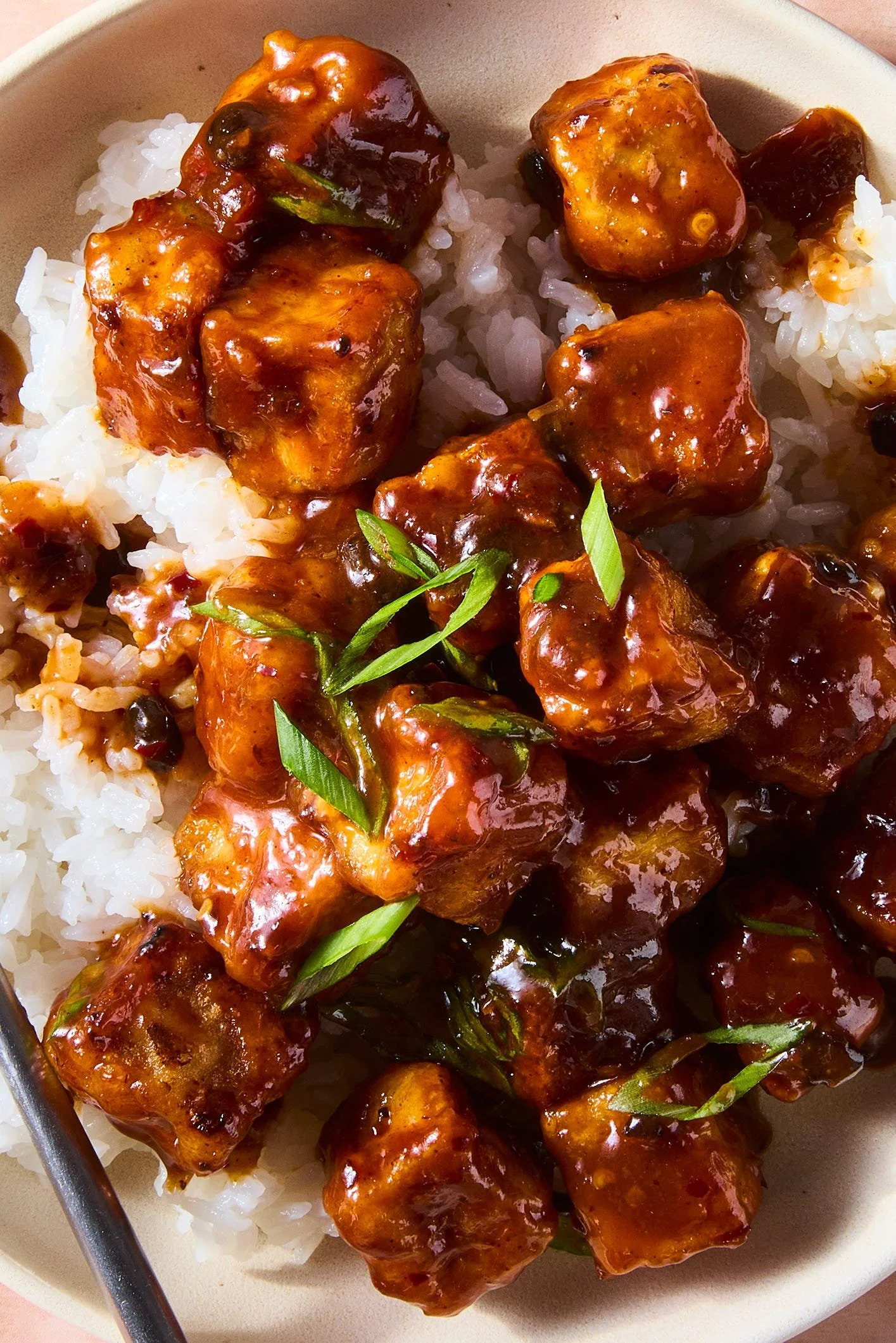Crispy fried tofu topped with colorful chili crisp sauce for a flavorful dish