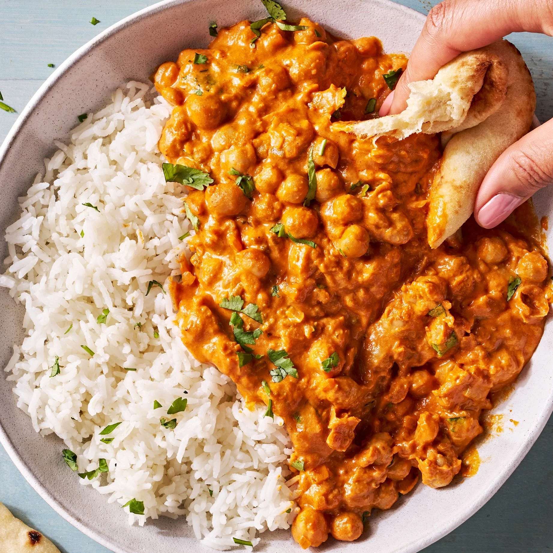Delicious Indian Butter Chickpeas served in a bowl with spices and herbs