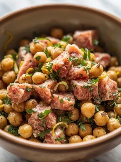 Bowl of Lemon Herb Tuna and Chickpea Salad with fresh ingredients