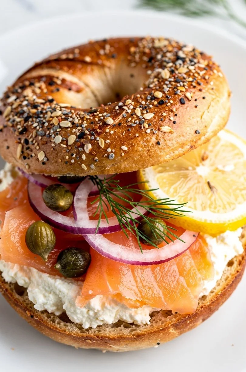 Protein-packed smoked salmon ricotta bagel served on a wooden board