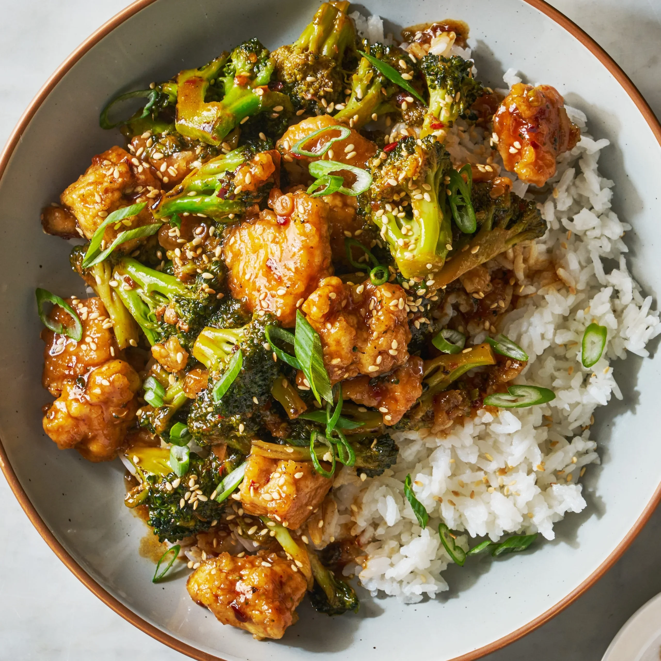 Sesame Tofu and Broccoli dish, vibrant presentation with sesame seeds and greens