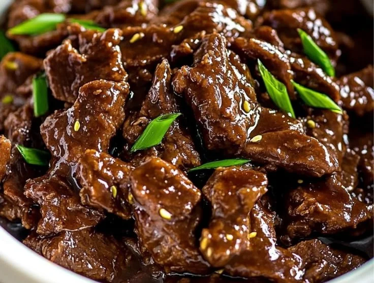 Delicious Slow Cooker Mongolian Beef served in a bowl with vegetables